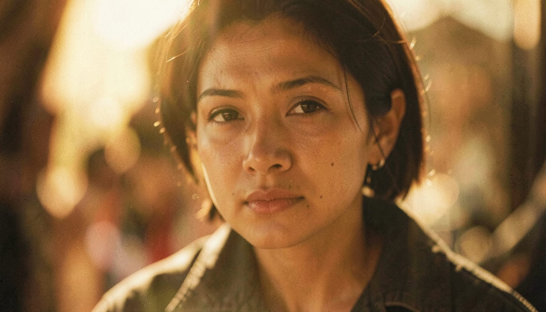 Soft-focus cinematic scene with warm golden light, emotional close-up atmosphere